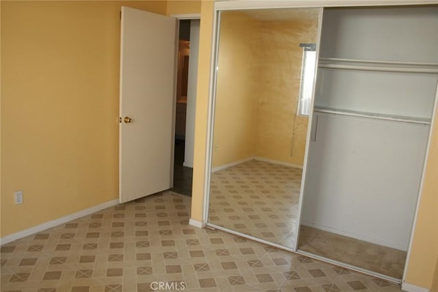 unfurnished bedroom with a closet