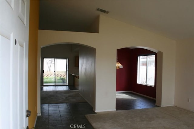 view of carpeted foyer entrance