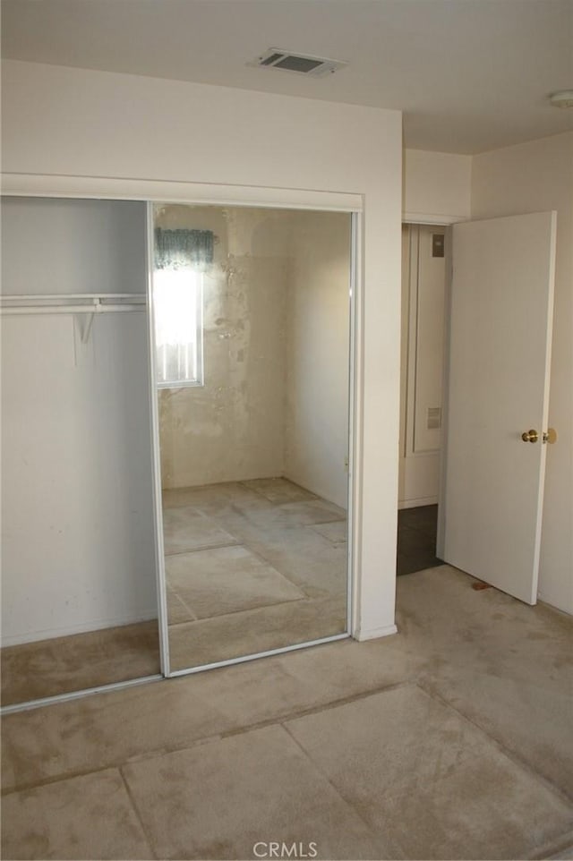 unfurnished bedroom with a closet