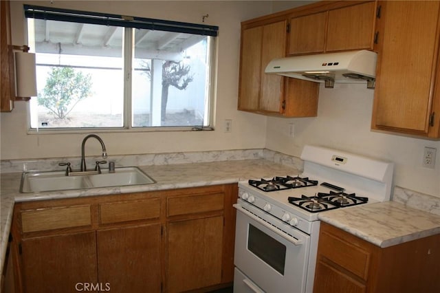 kitchen featuring sink and gas range gas stove