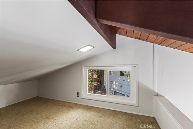 bonus room featuring lofted ceiling with beams and carpet floors