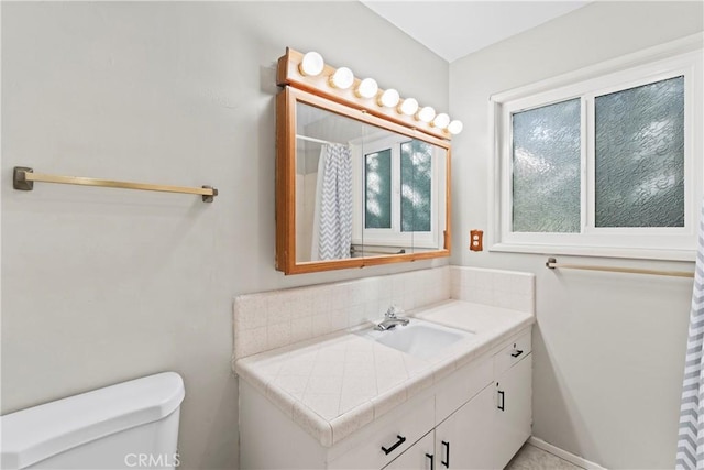 full bath featuring toilet and vanity