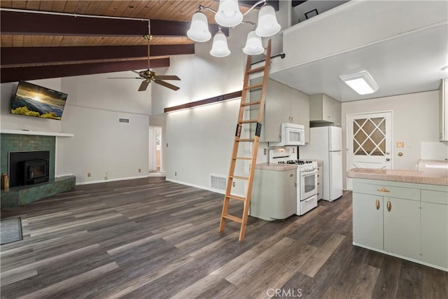 kitchen featuring light countertops, dark wood-type flooring, open floor plan, white cabinets, and white appliances