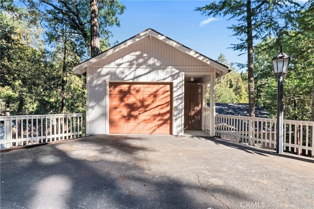 detached garage featuring driveway