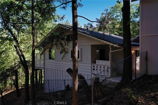 view of property exterior featuring fence