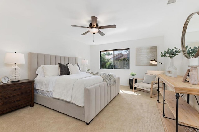 bedroom with light colored carpet and ceiling fan