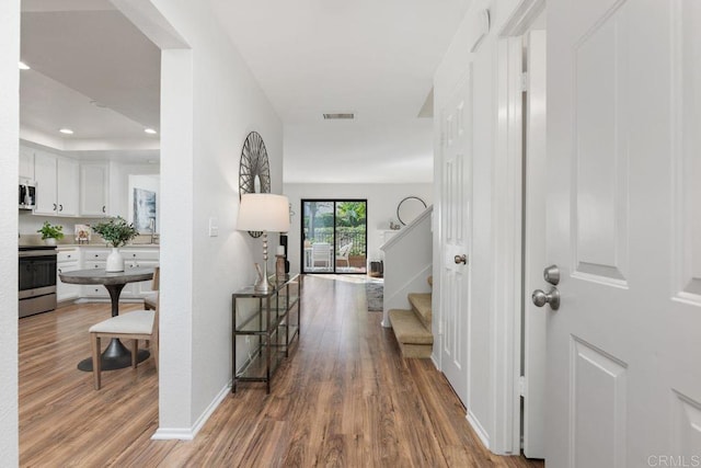 hallway featuring light wood-type flooring