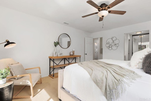 bedroom featuring ceiling fan and light colored carpet