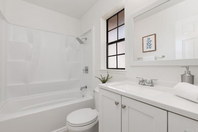 full bathroom with vanity, toilet, and  shower combination