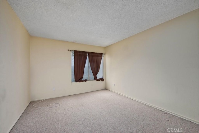 23515 Lyons Ave Unit 228, Valencia, CA 91355 - spare room featuring carpet, a textured ceiling, and baseboards