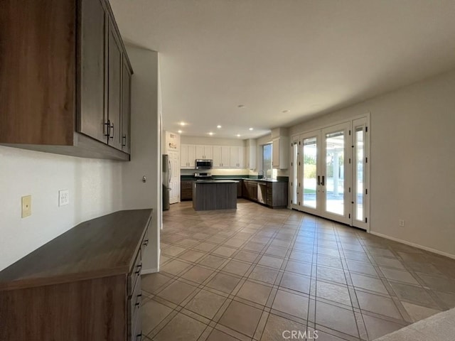 kitchen with french doors, light tile patterned floors, stainless steel appliances, recessed lighting, and baseboards