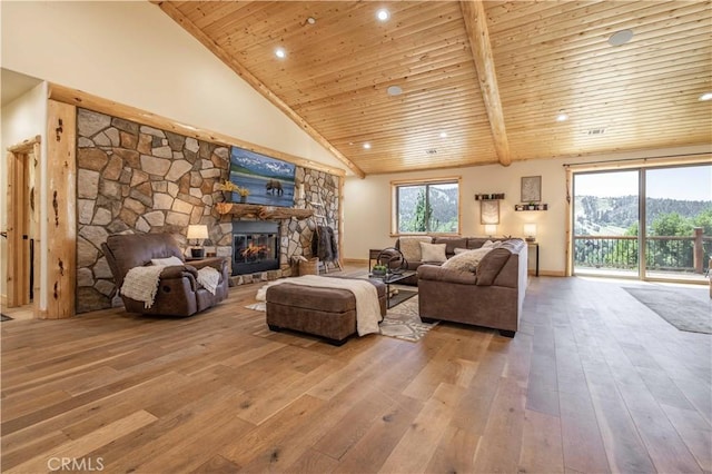 43625 Wolf Rd, Big Bear Lake, CA 92315 - living room featuring high vaulted ceiling, plenty of natural light, hardwood / wood-style floors, and a fireplace