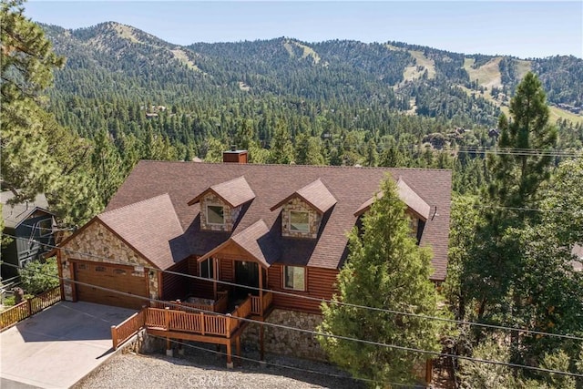 exterior space featuring a mountain view and a garage