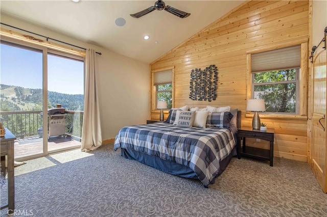 43625 Wolf Rd, Big Bear Lake, CA 92315 - bedroom featuring multiple windows, lofted ceiling, access to outside, and wood walls