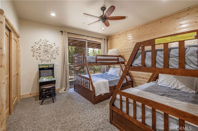 43625 Wolf Rd, Big Bear Lake, CA 92315 - bedroom featuring carpet, ceiling fan, and wood walls