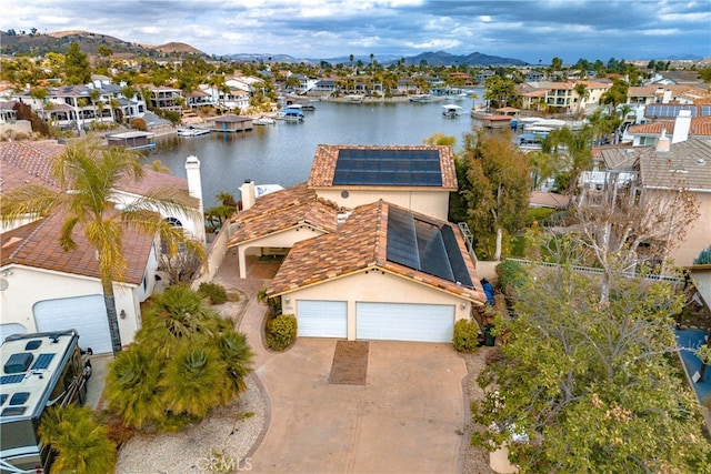 bird's eye view with a water and mountain view