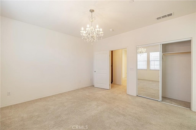 22059 Barrington Way, Saugus, CA 91350 - unfurnished bedroom featuring light carpet, a chandelier, a closet, and baseboards