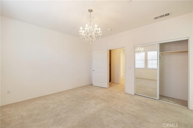 22059 Barrington Way, Saugus, CA 91350 - unfurnished bedroom with light carpet, a chandelier, and a closet