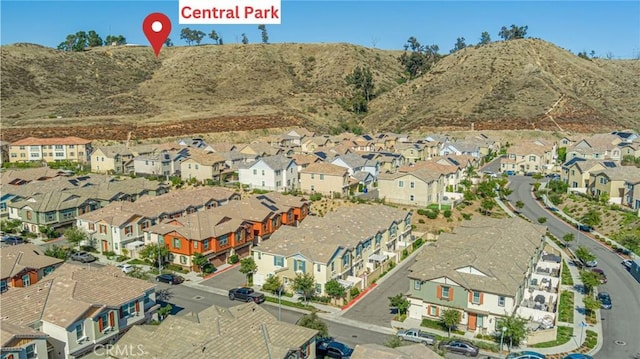 22059 Barrington Way, Saugus, CA 91350 - aerial overview of property's location with nearby suburban area and a mountain backdrop