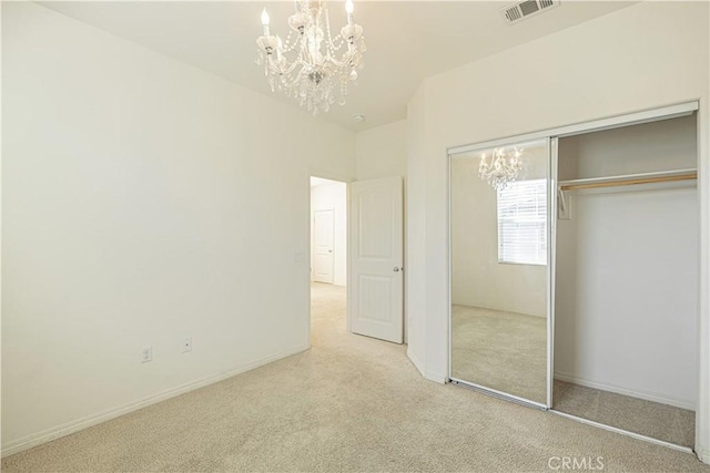 22059 Barrington Way, Saugus, CA 91350 - unfurnished bedroom featuring a chandelier, carpet, a closet, and baseboards