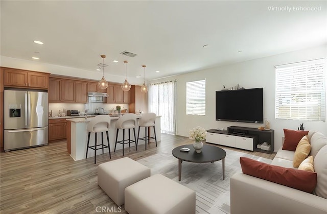 22059 Barrington Way, Saugus, CA 91350 - living room featuring recessed lighting and light wood finished floors