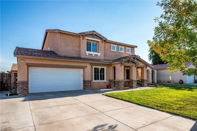 view of front of property with a garage and a front lawn