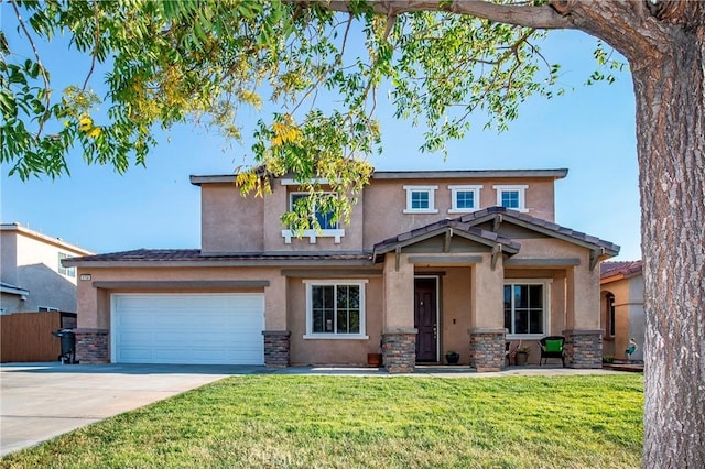 view of front of home featuring a garage and a front lawn