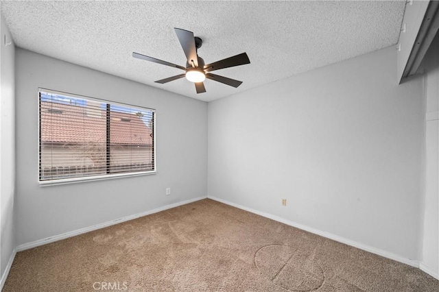 empty room with light colored carpet, a textured ceiling, and ceiling fan