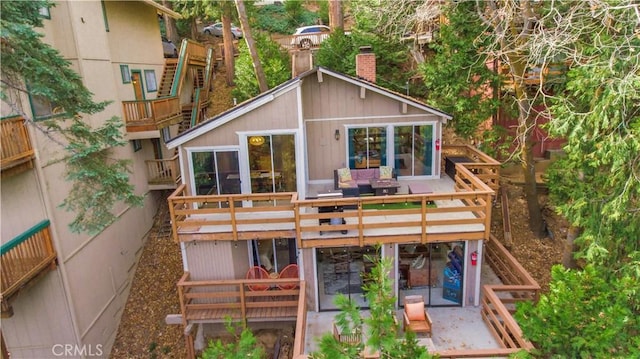 579 E Victoria Ct, Lake Arrowhead, CA 92352 - back of house with stairway and a deck