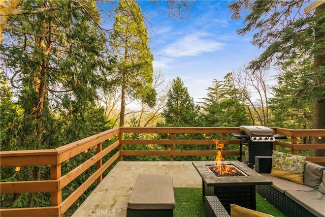 579 E Victoria Ct, Lake Arrowhead, CA 92352 - exterior space with an outdoor living space with a fire pit and a grill