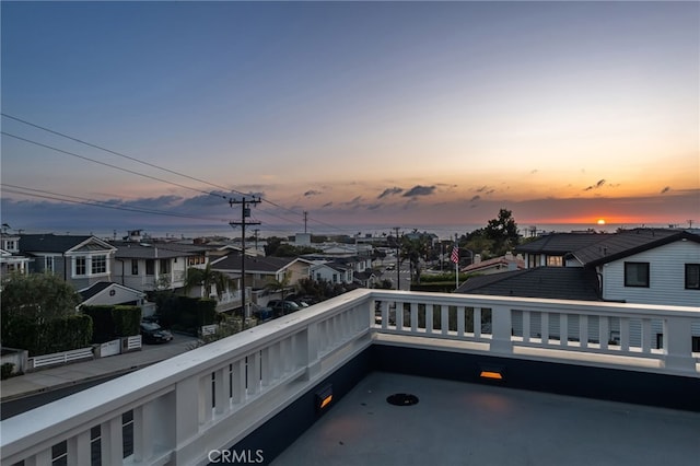 view of balcony at dusk