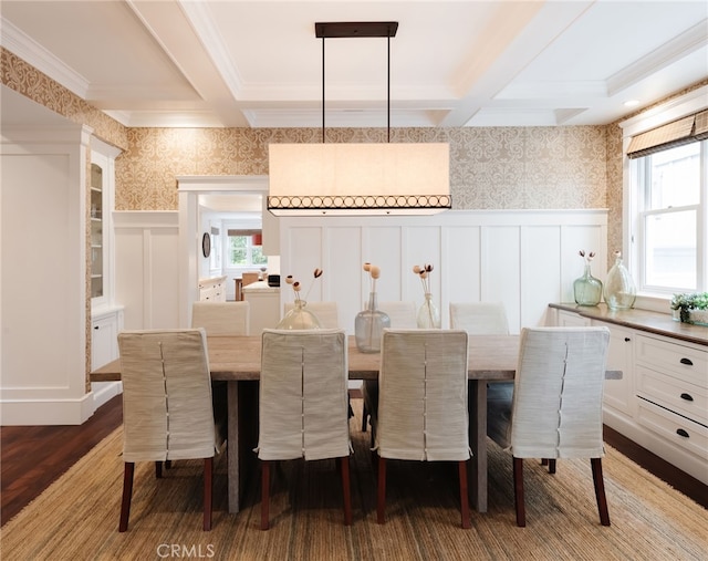 dining room featuring coffered ceiling, hardwood / wood-style floors, and beam ceiling