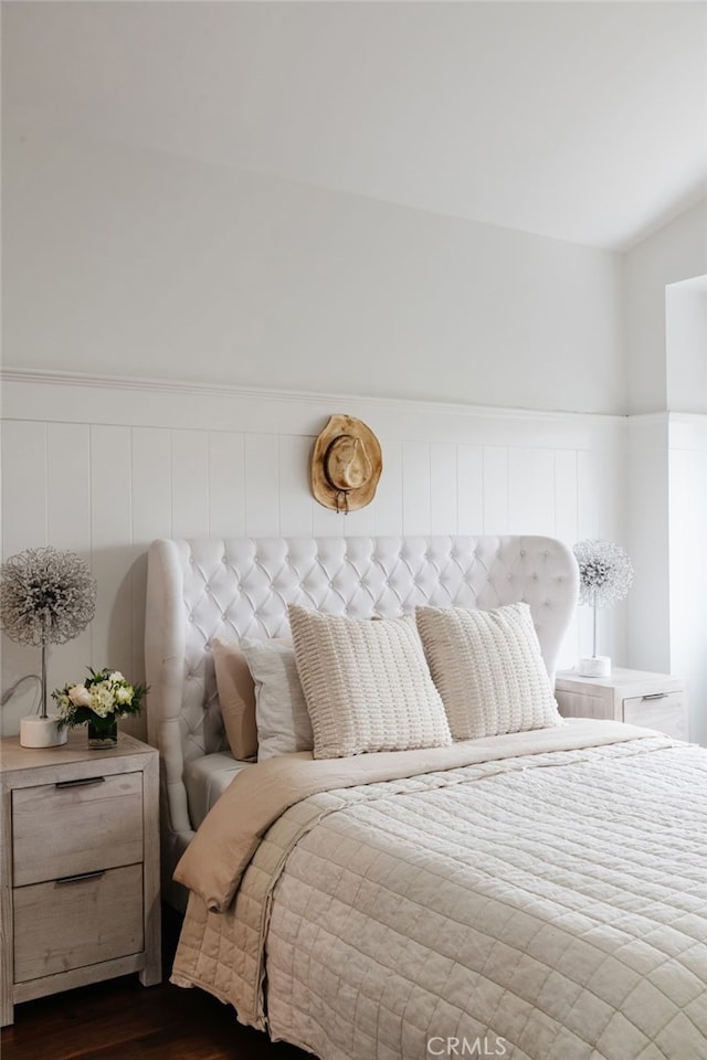 bedroom featuring dark hardwood / wood-style flooring