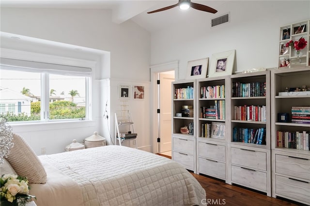 bedroom with dark hardwood / wood-style flooring and vaulted ceiling with beams