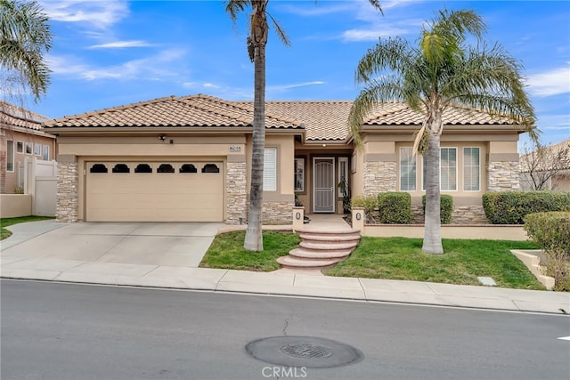 mediterranean / spanish-style house with a garage