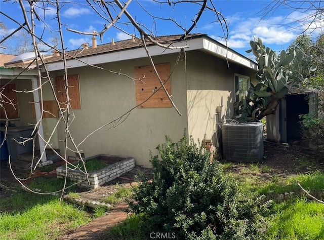 view of home's exterior with central AC unit