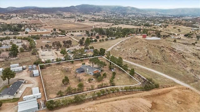 birds eye view of property featuring a mountain view