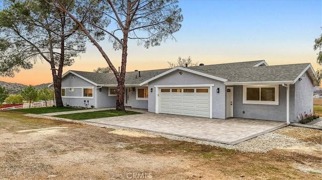 single story home with a garage