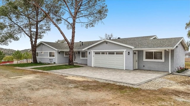 single story home with a garage