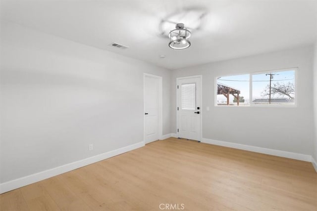 unfurnished room featuring light hardwood / wood-style flooring