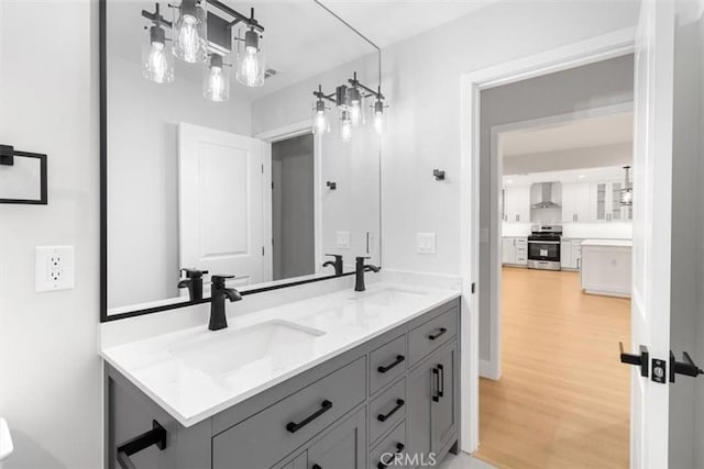 bathroom featuring vanity and hardwood / wood-style floors