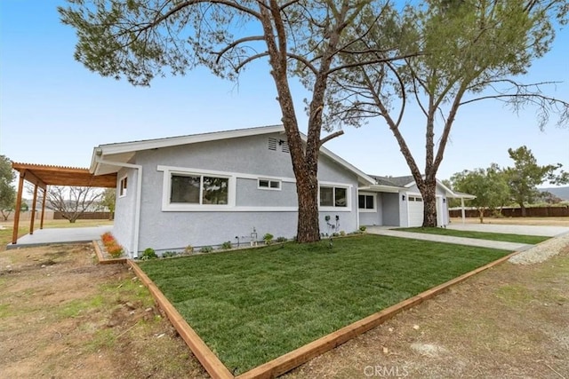 view of front of property with a garage, a pergola, and a front lawn