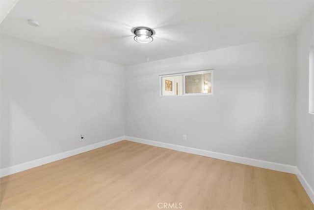 empty room featuring hardwood / wood-style flooring