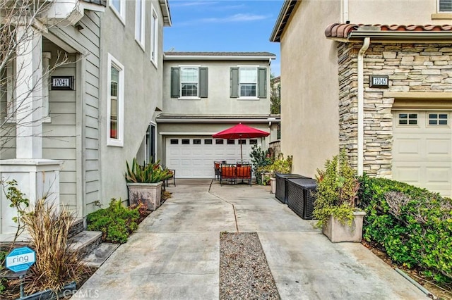 view of side of home featuring a garage