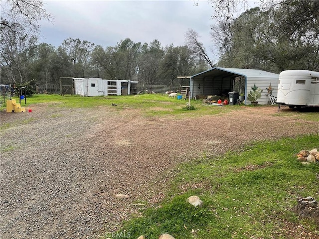 view of yard with a carport