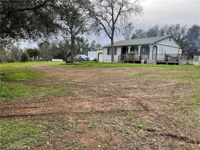 view of yard featuring a wooden deck