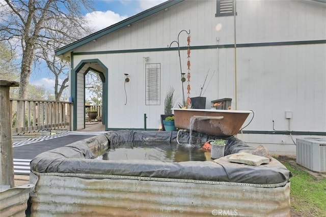 rear view of property featuring cooling unit