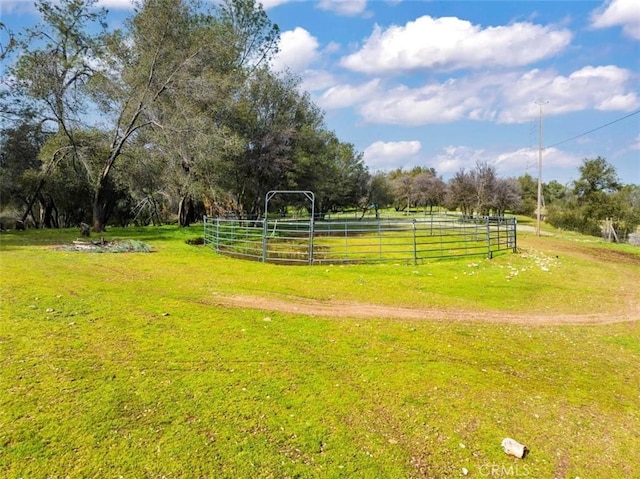 surrounding community featuring a rural view and a yard