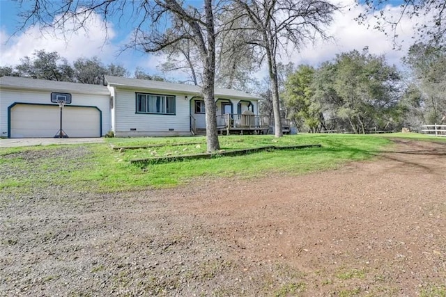 single story home with a garage and a front lawn