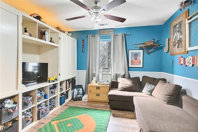 interior space with ceiling fan and light hardwood / wood-style floors